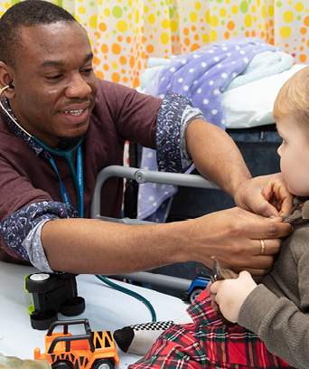 Male doctor with young male toddler