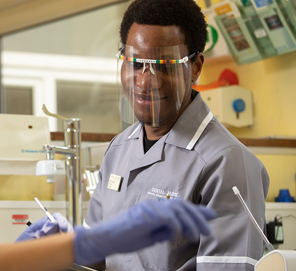 Male in uniform in dental surgery room