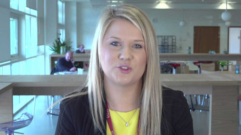 Female in suit looking at camera