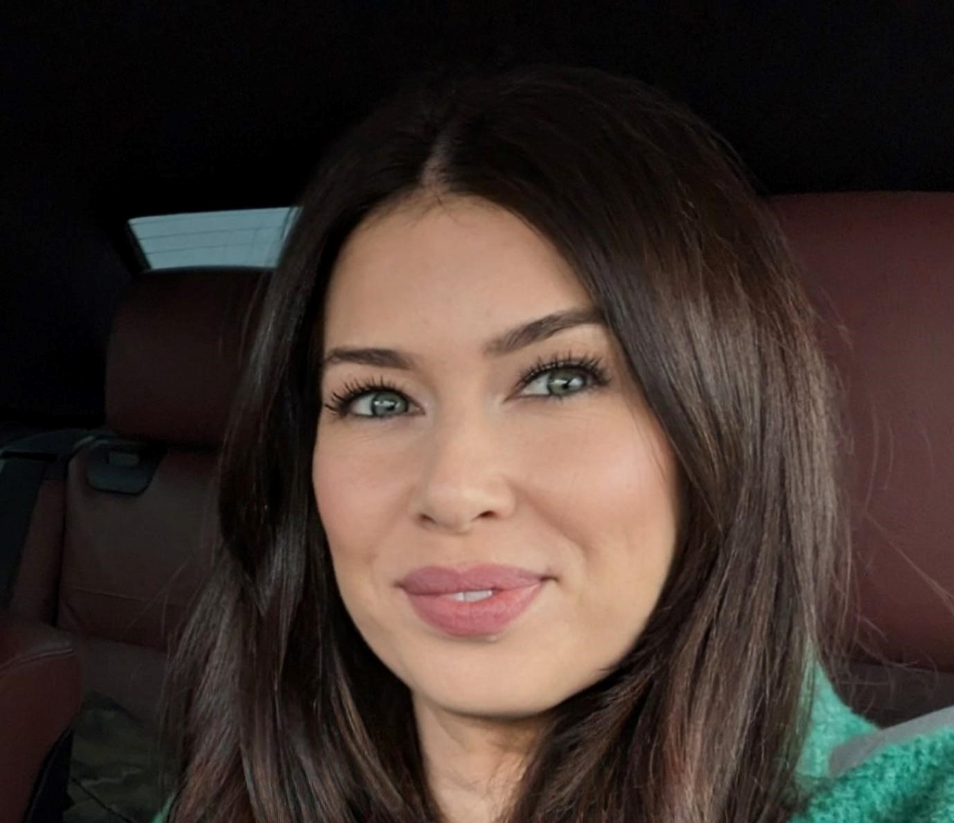 Female standing outside looking at camera