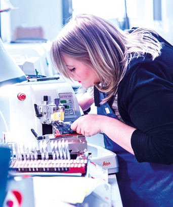 Female technologist working with samples