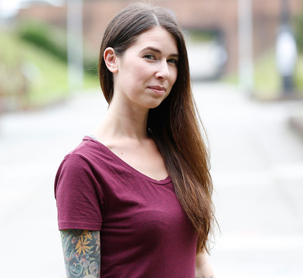 Female standing outside looking at camera