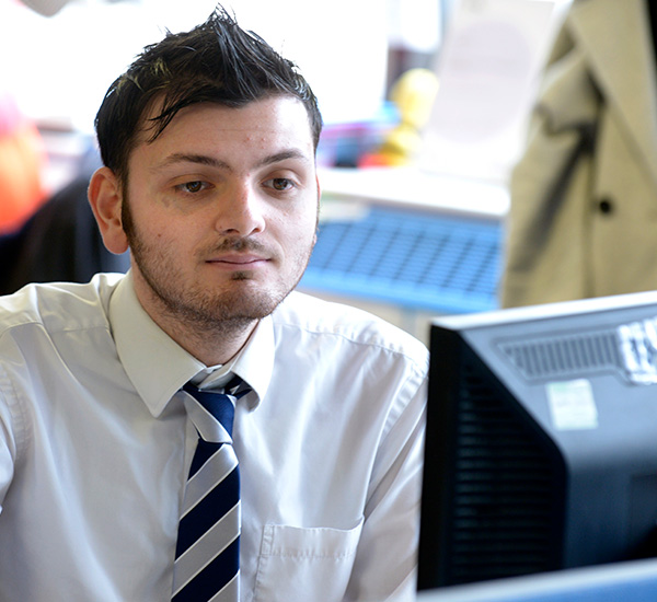 Male looking at computer screen