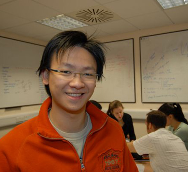 Male in training room smiling at camera