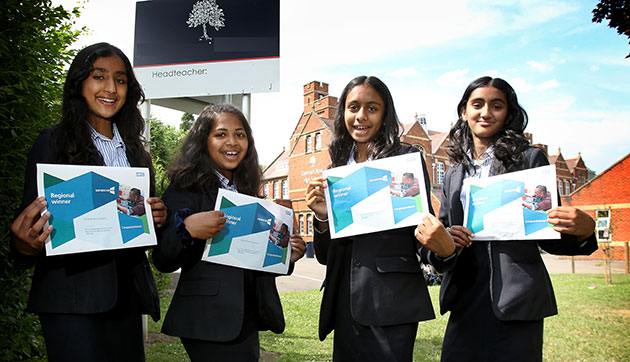 Four students holding certificates Four students holding certificates