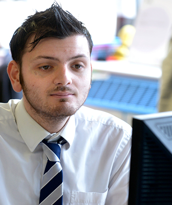 Male looking at computer screen