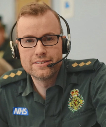 Male in uniform wearing headset