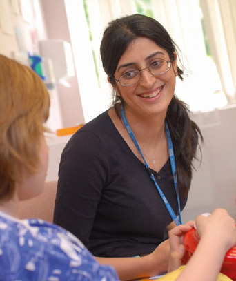 Female staff member smiling at patient