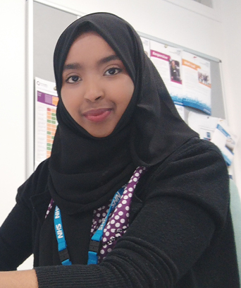 Female in office looking at camera