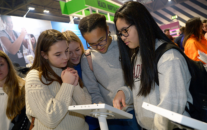 Female students looking at iPad